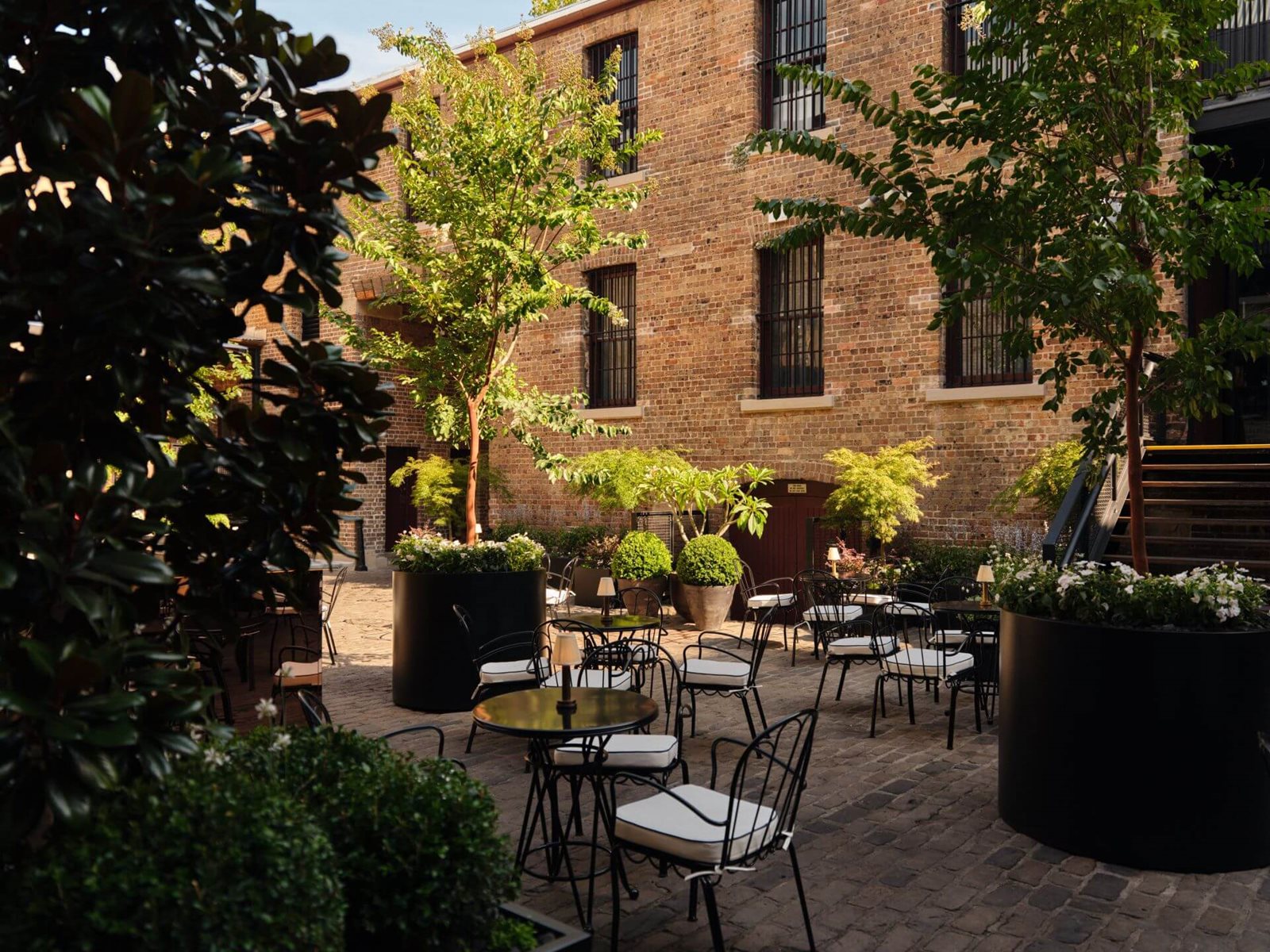 Green courtyard seating at The Garden